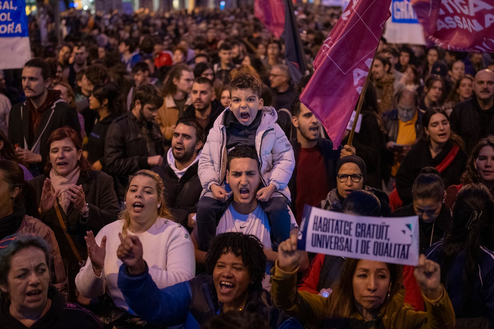 Demonstrators march to protest the skyrocketing cost of renting an apartment in Barcelona, Spain, Saturday, Nov. 23, 2024. (AP Photo/Emilio Morenatti)