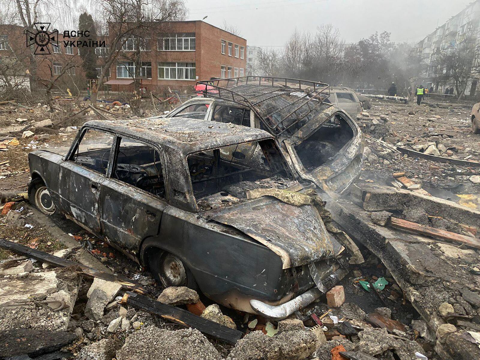 In this photo provided by the Ukrainian Emergency Service, damaged cars are seen near a ruined apartment building following a Russian rocket attack in Poltava, Ukraine, Saturday, Feb. 1, 2025. (Ukrainian Emergency Service via AP)