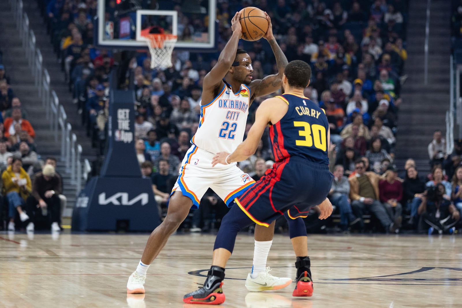 Golden State Warriors guard Stephen Curry (30) defends against Oklahoma City Thunder guard Cason Wallace during the first half of an NBA basketball game Wednesday, Jan. 29, 2025, in San Francisco. (AP Photo/Benjamin Fanjoy)