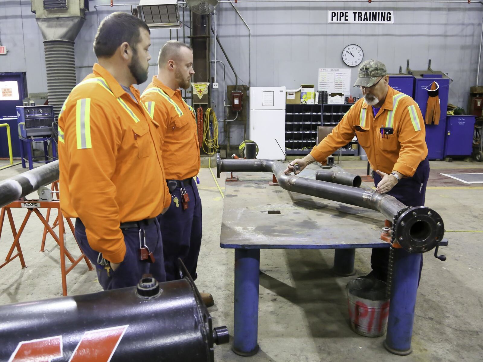 Jon Giltrow, Piping Apprentice Instructor, works with apprentices Chase Johnson and Justin Mullins as part of their new Maintenance Mechanic Apprenticeship Program, Friday, Oct. 5, 2018. 