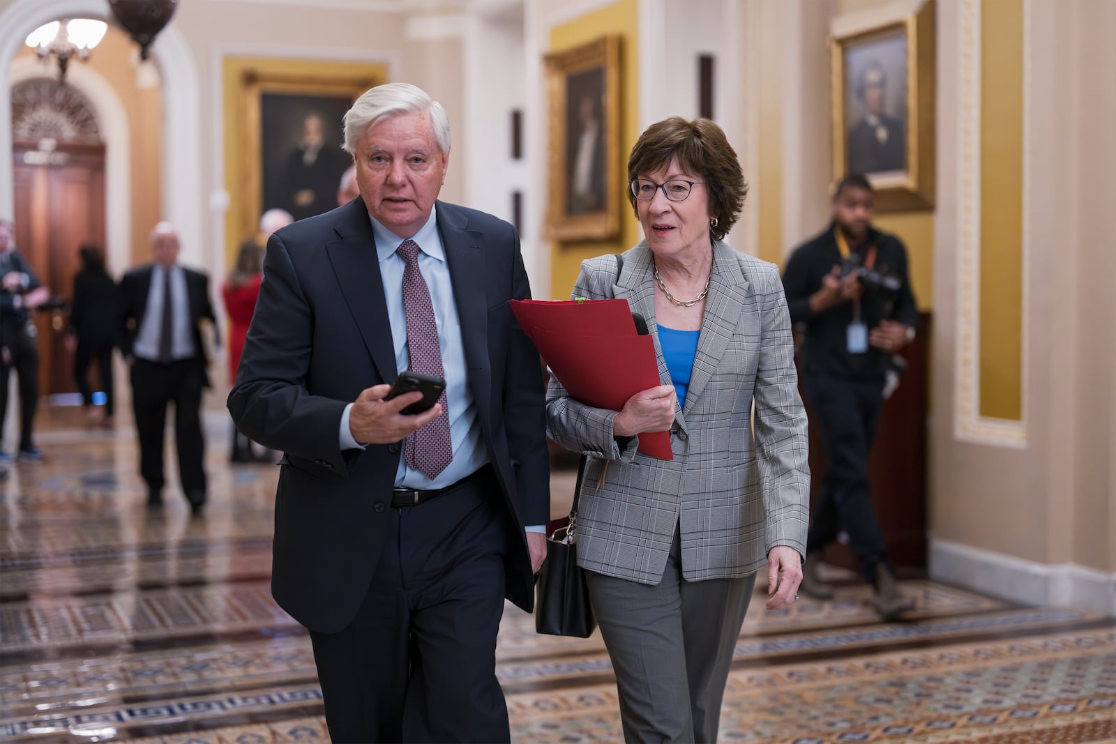 Senate Budget Committee Chairman Lindsey Graham, R-S.C., left, and Sen. Susan Collins, R-Maine, walk to the chamber as senators gather for the final vote on Kash Patel, President Donald Trump's nominee to be FBI director, at the Capitol in Washington, Thursday, Feb. 20, 2025. (AP Photo/J. Scott Applewhite)