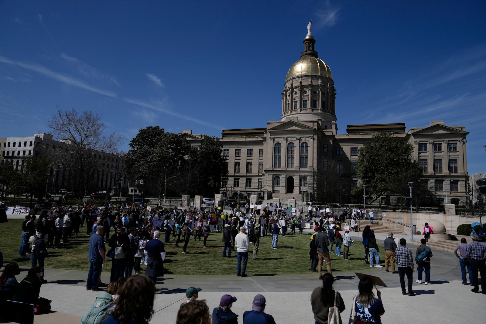 People attend a Stand up for Science rally in Liberty Plaza near the Georgia State capitol on Friday, March 7, 2025, in Atlanta. (AP Photo/Brynn Anderson)