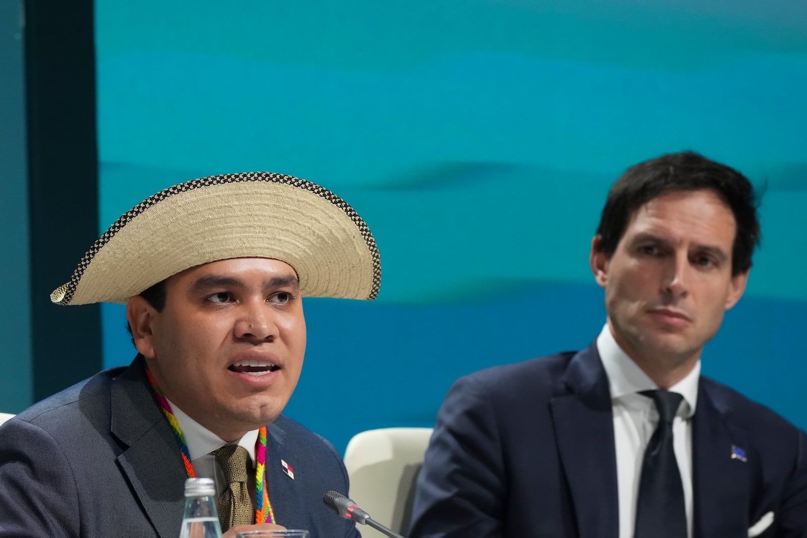 Panama Climate Envoy Juan Carlos Monterrey Gomez, left, and Wopke Hoekstra, EU climate commissioner, attend a session on climate targets during the COP29 U.N. Climate Summit, Thursday, Nov. 21, 2024, in Baku, Azerbaijan. (AP Photo/Sergei Grits)