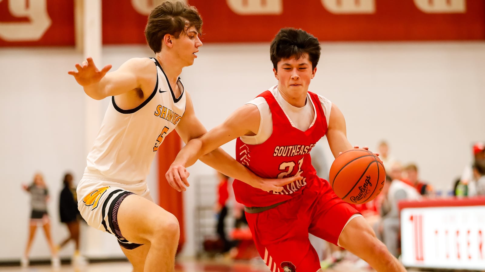 Southeastern senior Cole Walton drives the ball against Shawnee senior Cody Siemon during their game on Friday afternoon at Wittenberg University’s Pam Evans Smith Arena. Michael Cooper/CONTRIBUTED