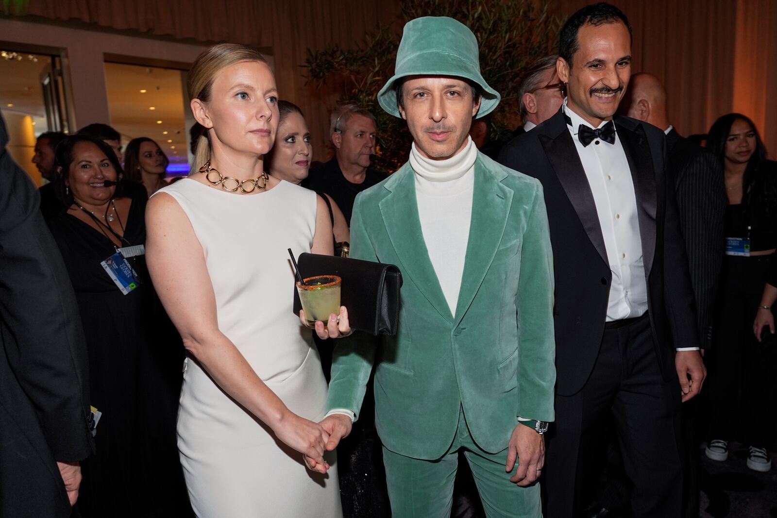 Emma Wall, left, and Jeremy Strong arrive at the 82nd Golden Globes on Sunday, Jan. 5, 2025, at the Beverly Hilton in Beverly Hills, Calif. (AP Photo/Chris Pizzello)