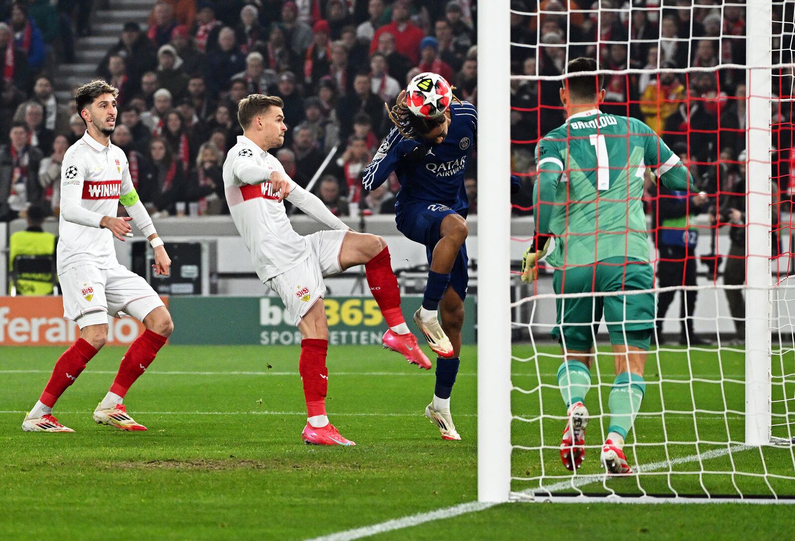 PSG's Bradley Barcola, centre right, scores the opening goal past Stuttgart's goalkeeper Fabian Bredlow during the Champions League opening phase soccer match between VfB Stuttgart and Paris Saint-Germain in Stuttgart, Germany, Jan. 29, 2025. (Marijan Murat/dpa via AP)