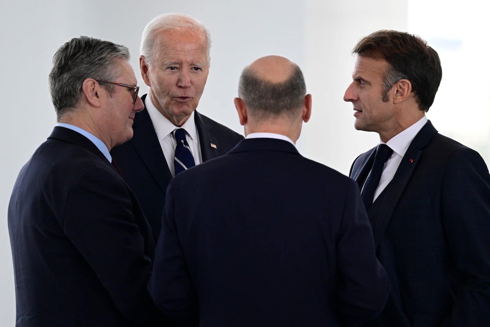 FILE - British Prime Minister Keir Starmer, from left, President Joe Biden, German Chancellor Olaf Scholz and French President Emmanuel Macron speak before attending their Quad meeting at the Chancellery in Berlin, on Oct. 18, 2024. (John Macdougall/Pool Photo via AP, File)