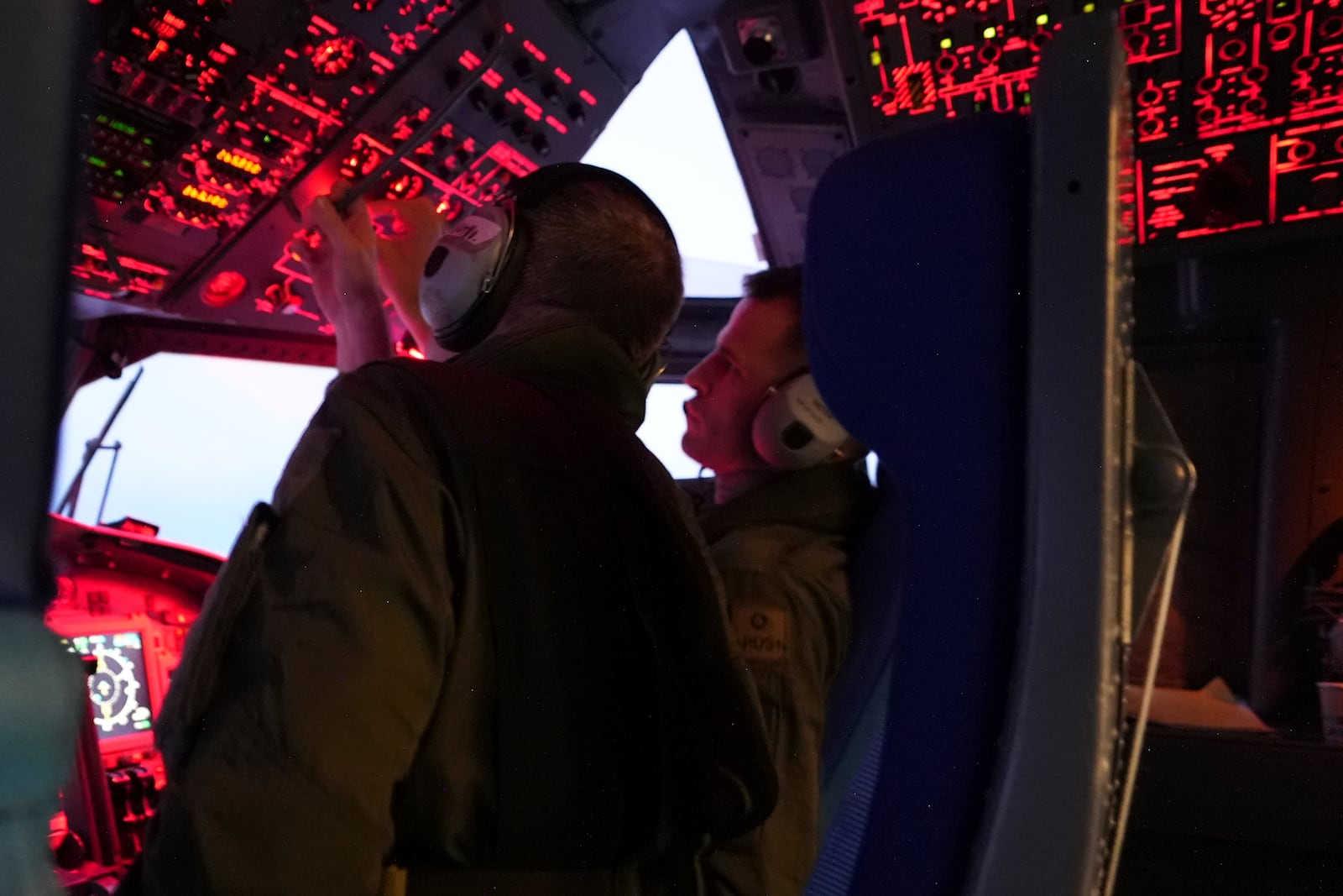 The flight-deck crew aboard a French Navy Atlantique 2 surveillance plane monitor their cockpit instruments as the aircraft patrols Thursday, Jan. 23, 2025, over the Baltic Sea as part of the NATO military alliance's "Baltic Sentry" mission to protect undersea cables and pipelines from sabotage. (AP Photo/John Leicester)