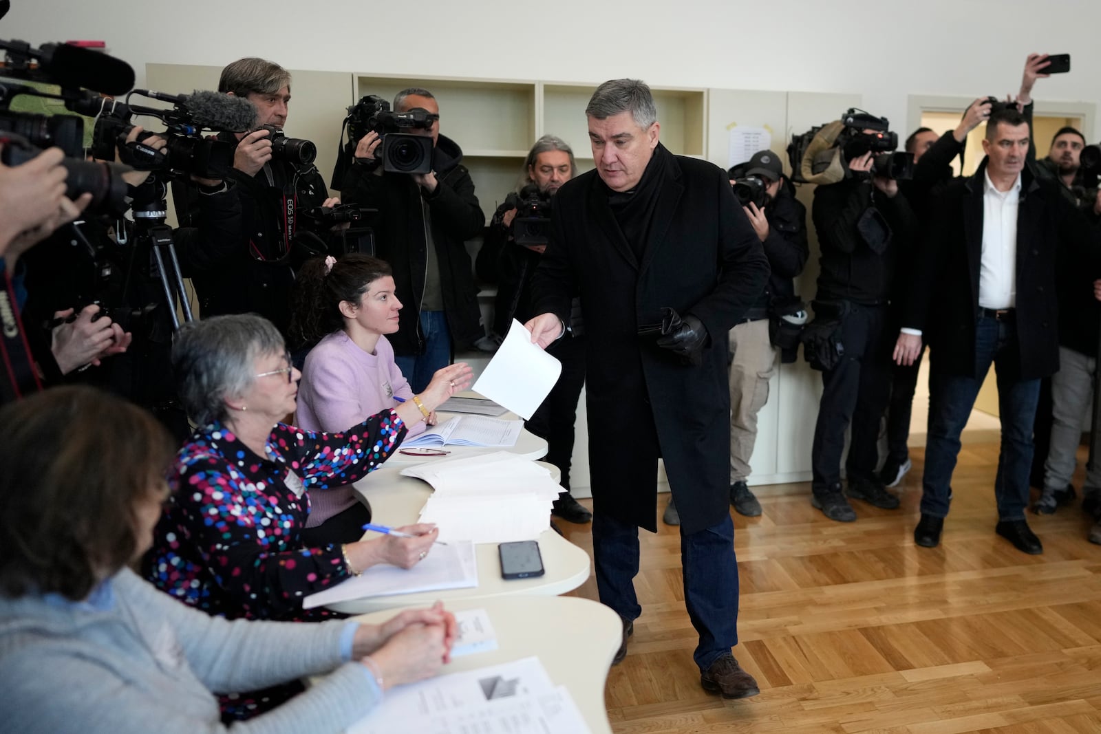 President incumbent Zoran Milanovic arrives to cast his ballot during a runoff vote for the Croatian presidential election at a polling station in Zagreb, Croatia, Sunday, Jan. 12, 2025. (AP Photo/Darko Bandic)