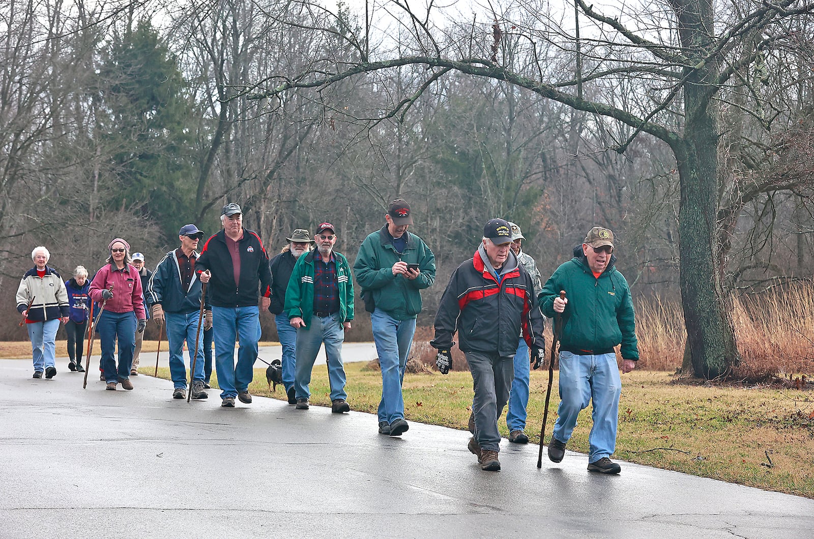 A group walks along the roadway through George Rogers Clark Park Thursday, Jan. 19, 2023. The group meets every Thursday morning to get some exercise by walking in the park. BILL LACKEY/STAFF