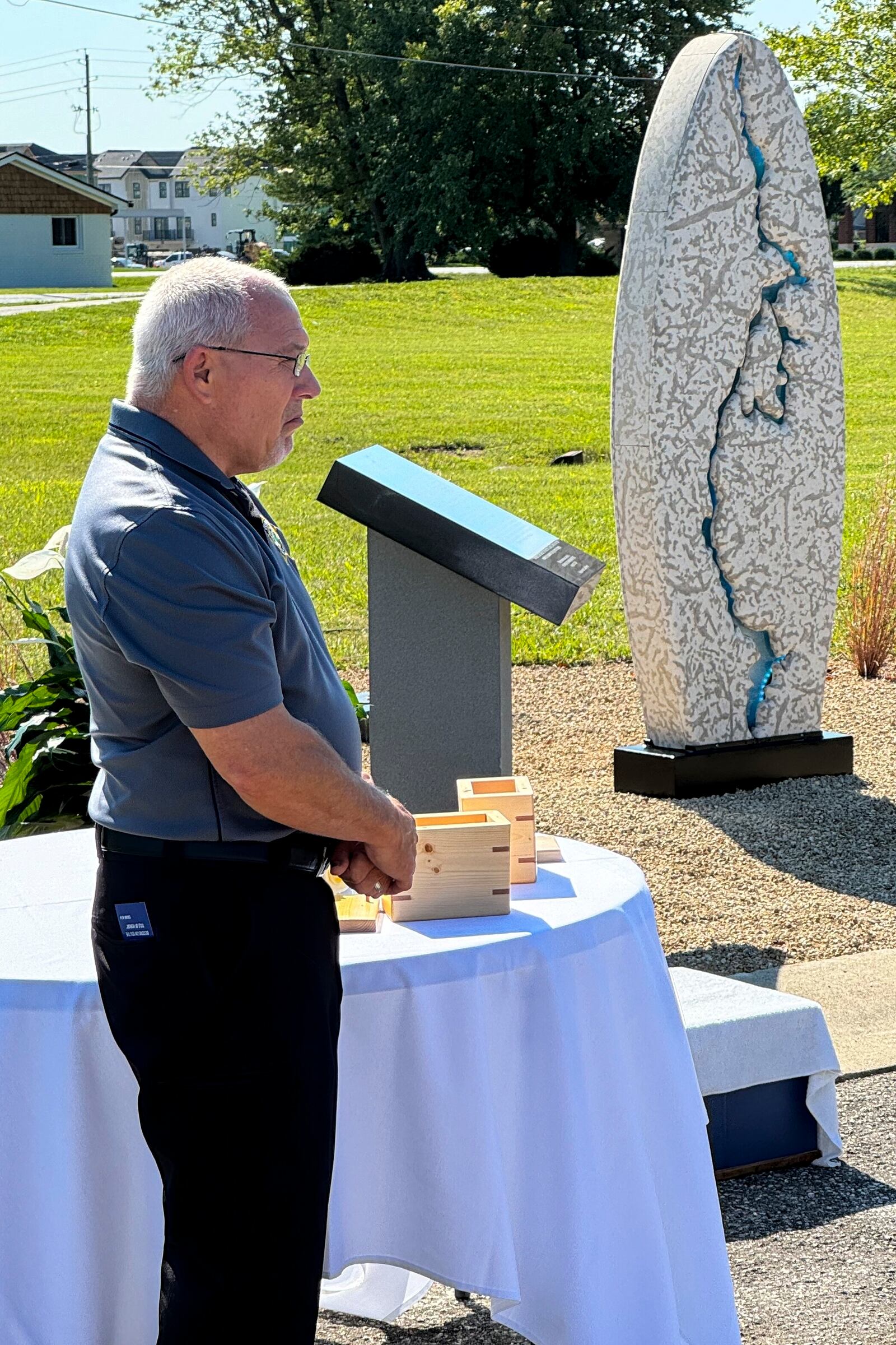 Hamilton County Coroner Jeff Jellison stands on August 29, 2024, in Westfield, Indiana, during the dedication of a memorial honoring suspected serial killer Herbert Baumeister's nine known victims. (AP Photo/Rick Callahan)