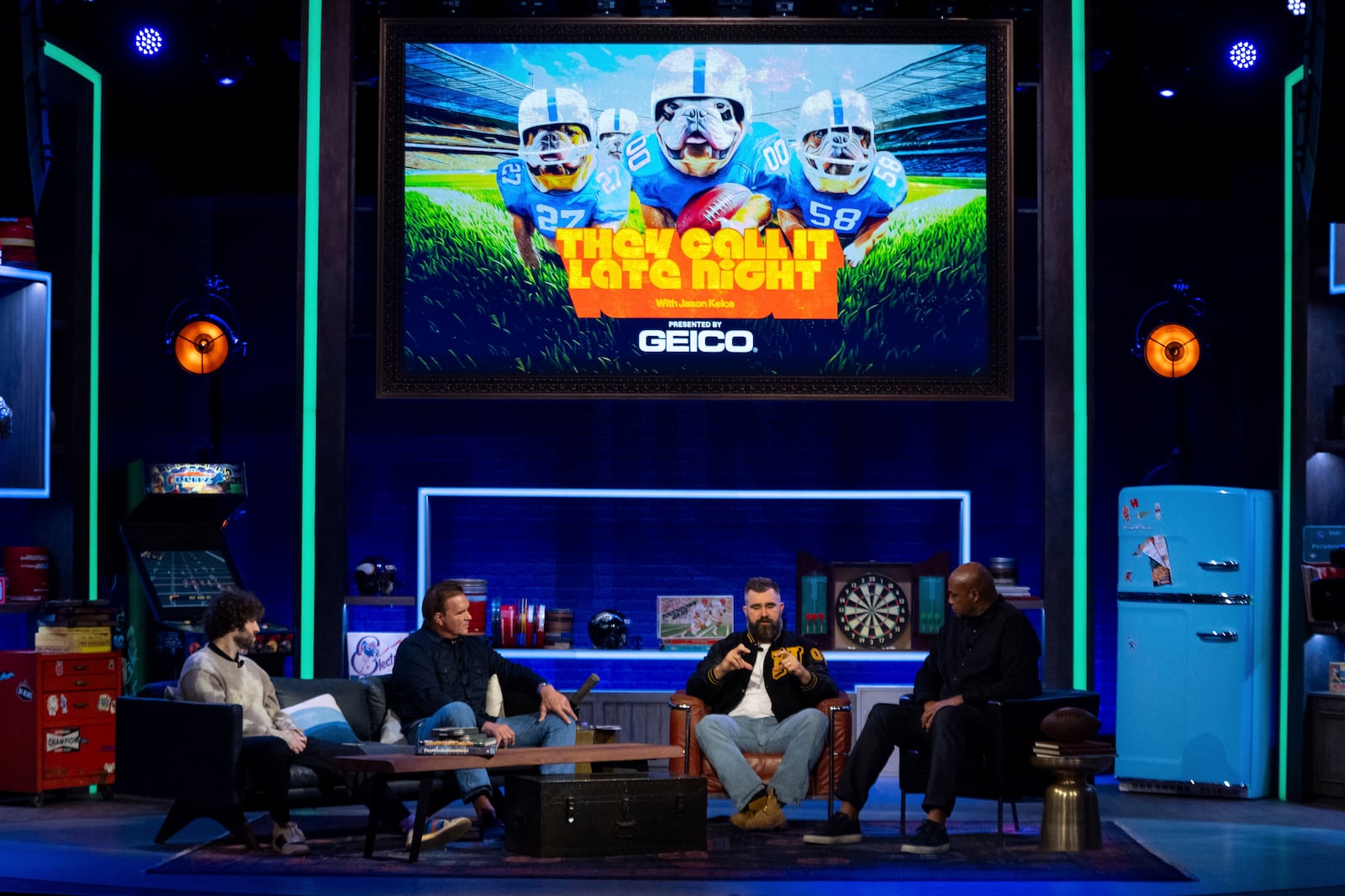 Former NFL player and ESPN analyst Jason Kelce, center right, talks with his guest: American Rapper and Comedian Lil Dicky, left, former NFL player Brian Baldinger, center left, and NBA Hall of Famer Charlies Barkley, right, during the taping of "They Call It Late Night with Jason Kelce", Friday, Jan. 3, 2025, in Philadelphia. (AP Photo/Chris Szagola)