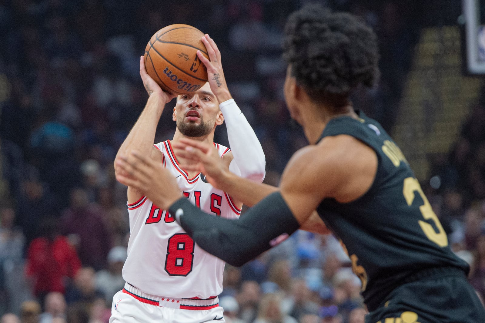 Chicago Bulls' Zach LaVine (8) looks to shoot as Cleveland Cavaliers' Jarrett Allen, right, defends during the first half of an Emirates NBA Cup basketball game in Cleveland, Friday, Nov 15, 2024. (AP Photo/Phil Long)