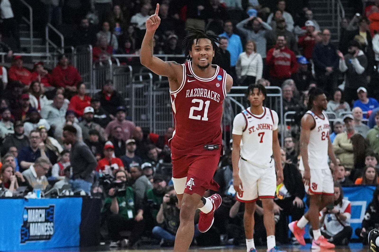 Arkansas guard D.J. Wagner (21) celebrates after defeating St. John's in the second round of the NCAA college basketball tournament, Saturday, March 22, 2025, in Providence, R.I. (AP Photo/Charles Krupa)