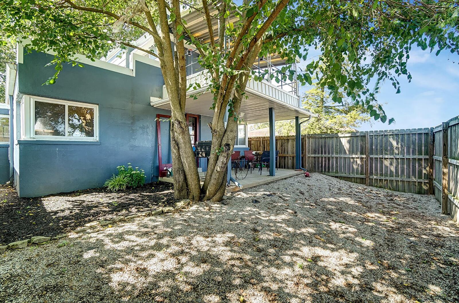 The rear of the home shows the double covered patios – the first, off the main bedroom suite, and the second off the great room and kitchen. The back yard has a wood privacy fence. CONTRIBUTED PHOTO