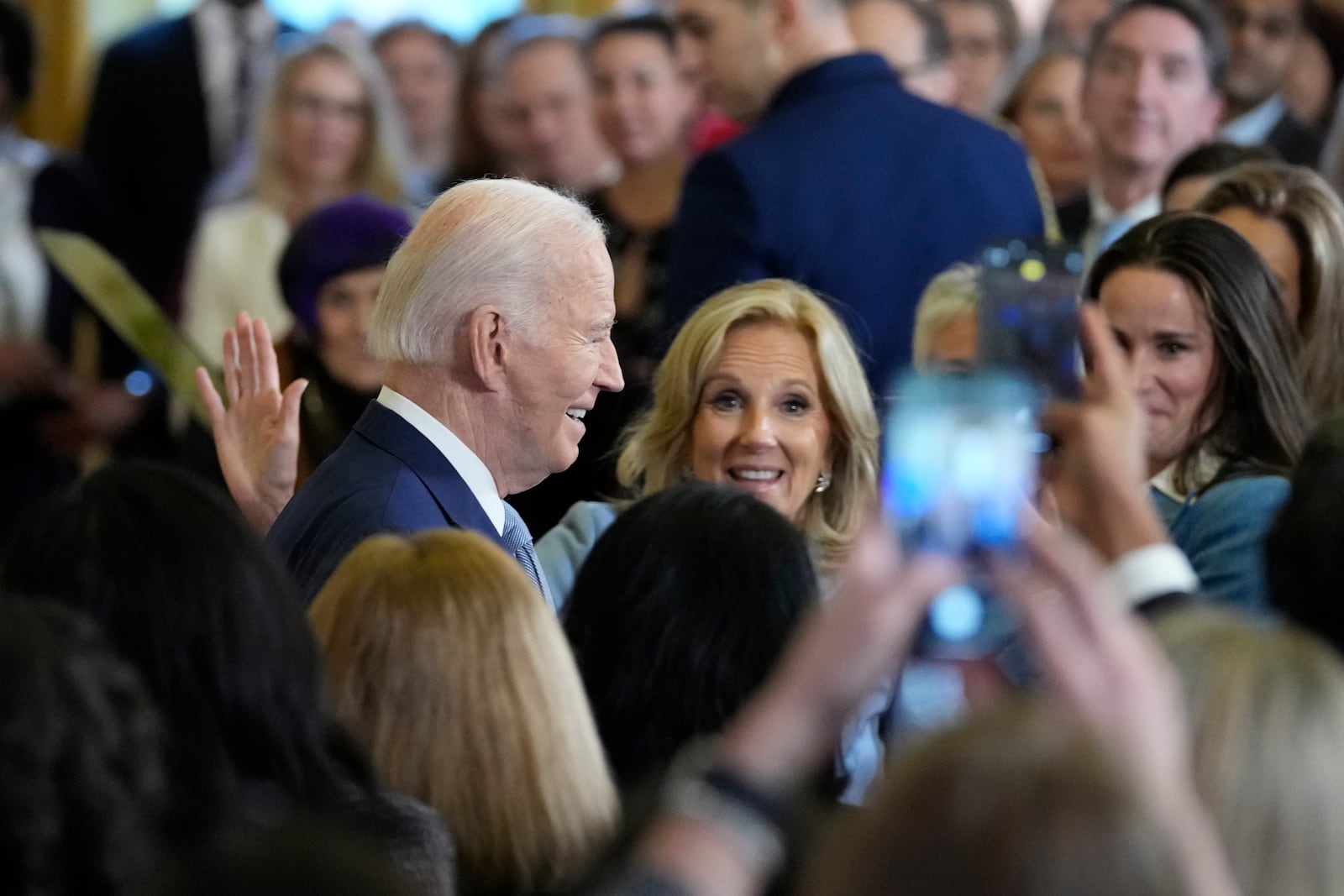 President Joe Biden, left, with first lady Jill Biden in the audience, center, and daughter Ashley Biden, right, walks out of the East Room of the White House after speaking at the White House Conference on Women's Health Research in Washington, Wednesday, Dec. 11, 2024. (AP Photo/Susan Walsh)