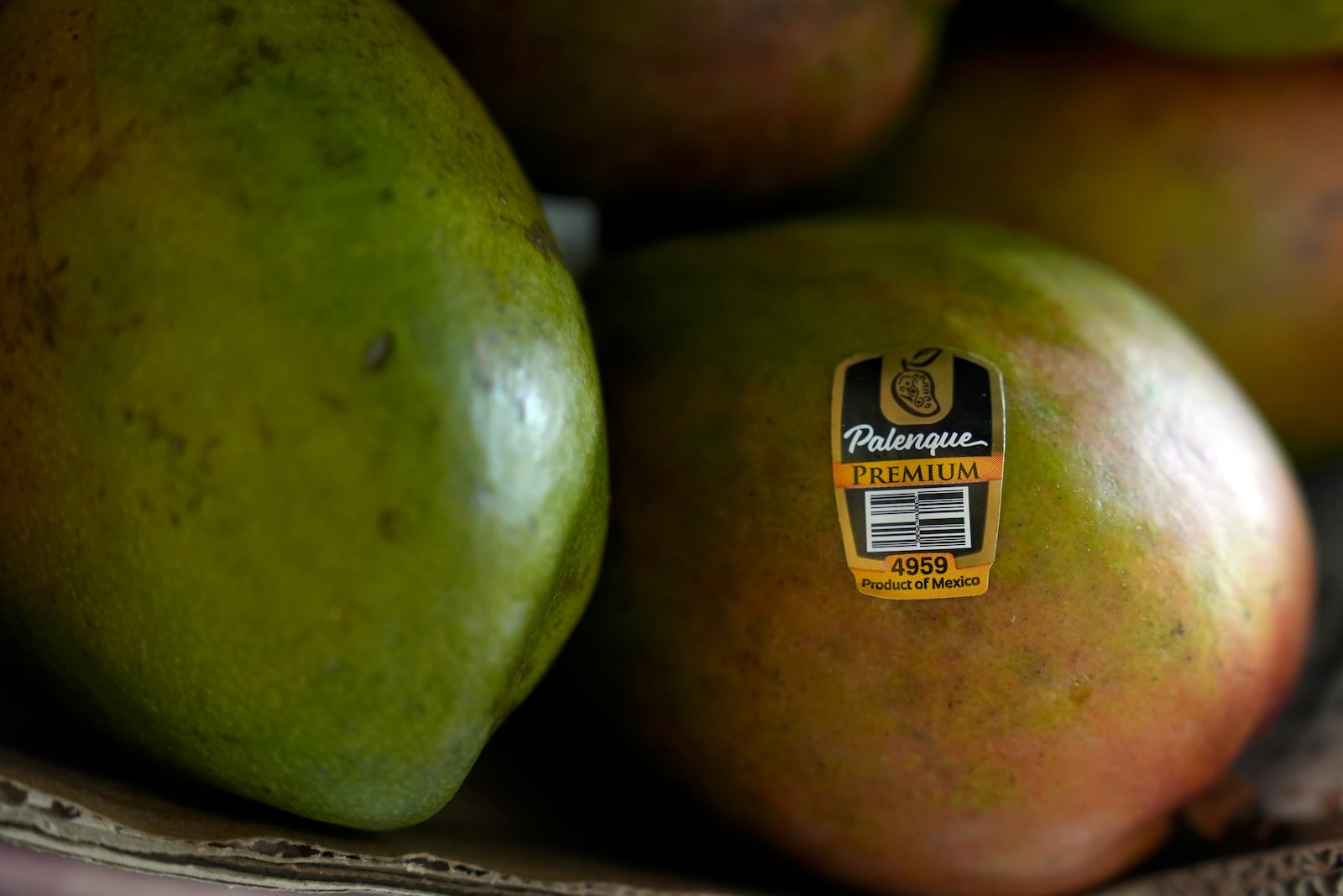 Mangoes for sale are displayed at a grocery store in San Francisco, Wednesday, March 5, 2025. (AP Photo/Jeff Chiu)