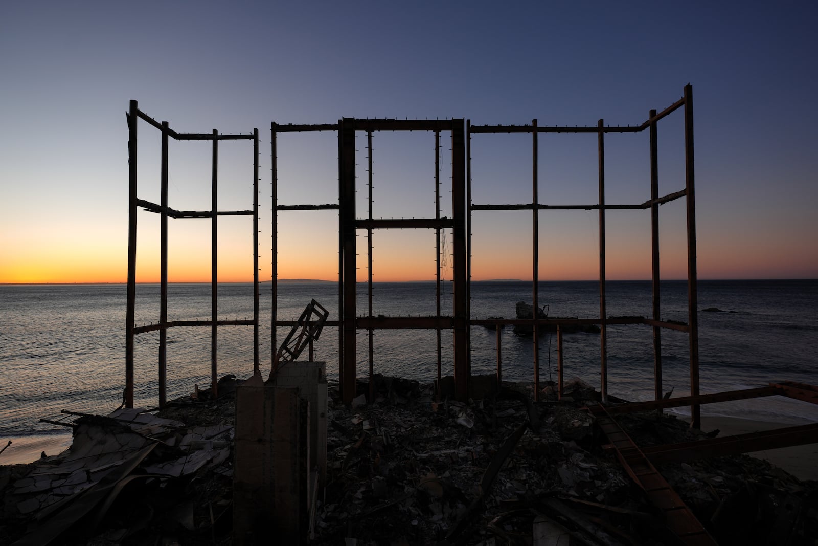 A beach front home destroyed by the Palisades Fire is seen in Malibu, Calif., Wednesday, Jan. 15, 2025. (AP Photo/Jae C. Hong)