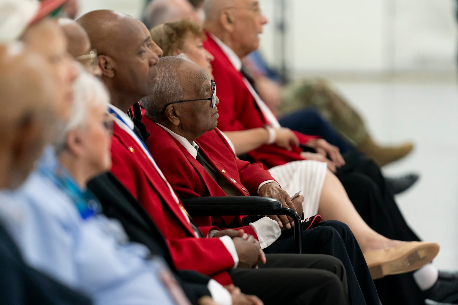 FILE - William Thomas Fauntroy Jr., center, is honored during a PT-17 aircraft exchange ceremony to commemorate the Tuskegee Airmen in recognition of the 75th anniversary of desegregation in the U.S. military, July 26, 2023, at Joint Base Andrews, Md. (AP Photo/Stephanie Scarbrough, File)