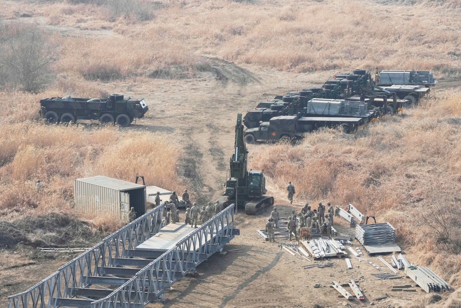 U.S. Army soldiers prepare to cross the Hantan river at a training field in Yeoncheon, South Korea, near the border with North Korea, Monday, March 10, 2025. (AP Photo/Ahn Young-joon)