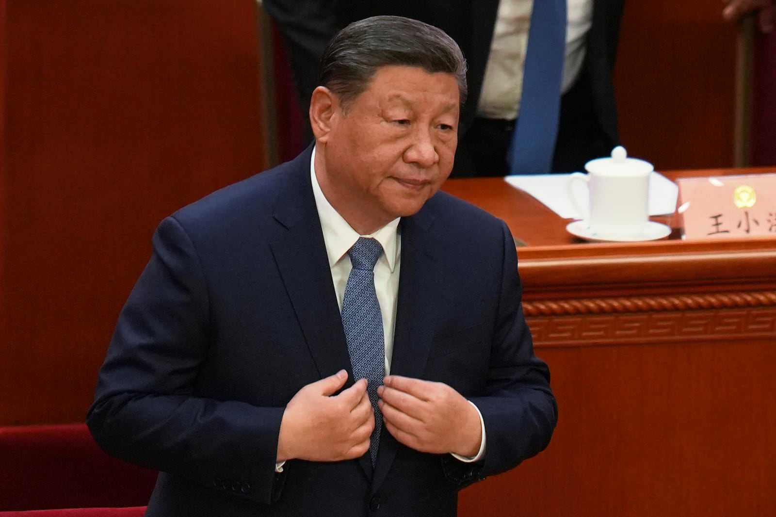 Chinese President Xi Jinping stands for the national anthem during the opening of the Chinese People's Political Consultative Conference held at the Great Hall of the People in Beijing, Tuesday, March 4, 2025. (AP Photo/Ng Han Guan)