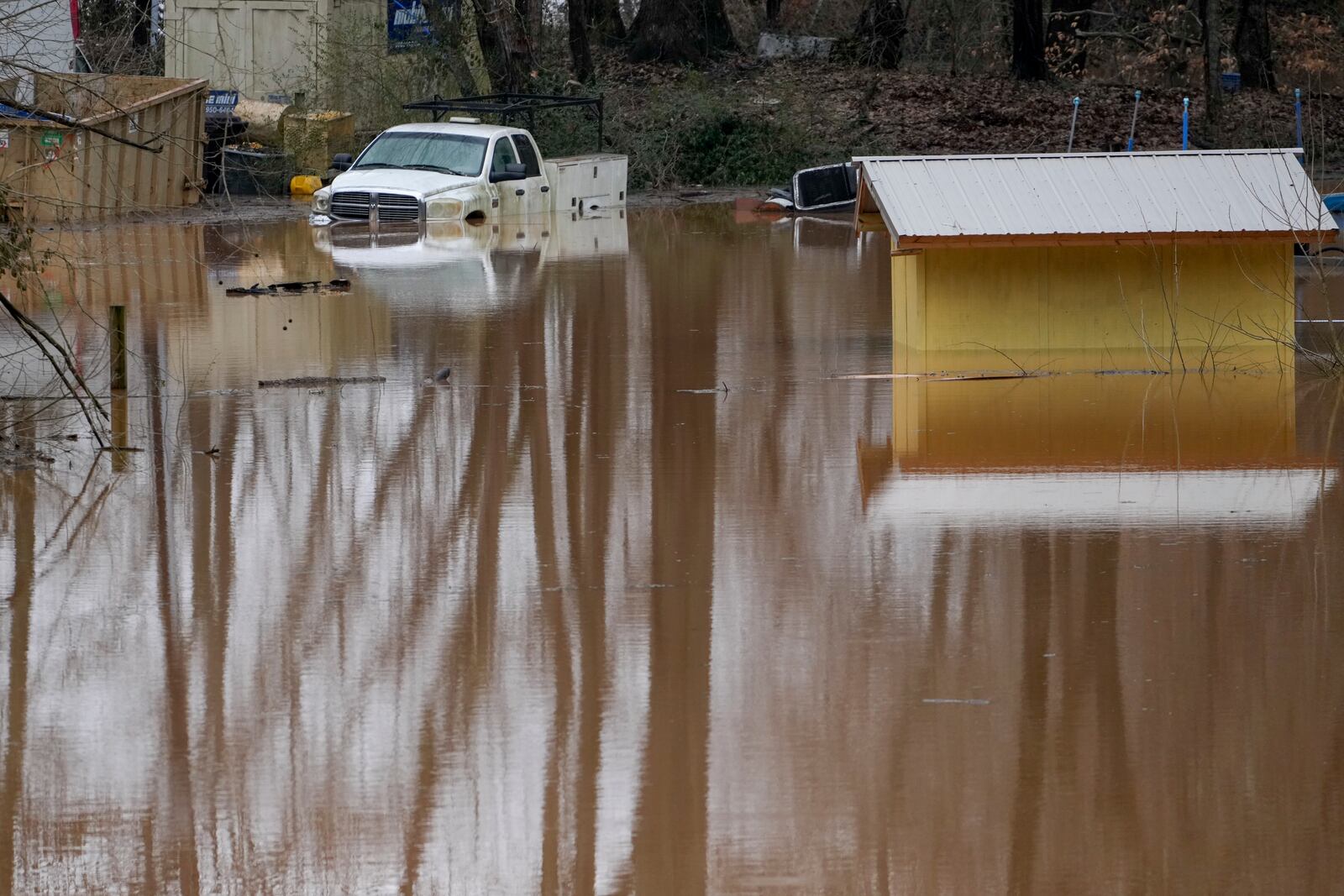 A truck sits in flood waters along the Cumberland River, Sunday, Feb. 16, 2025, in Clarksville, Tenn. (AP Photo/George Walker IV)