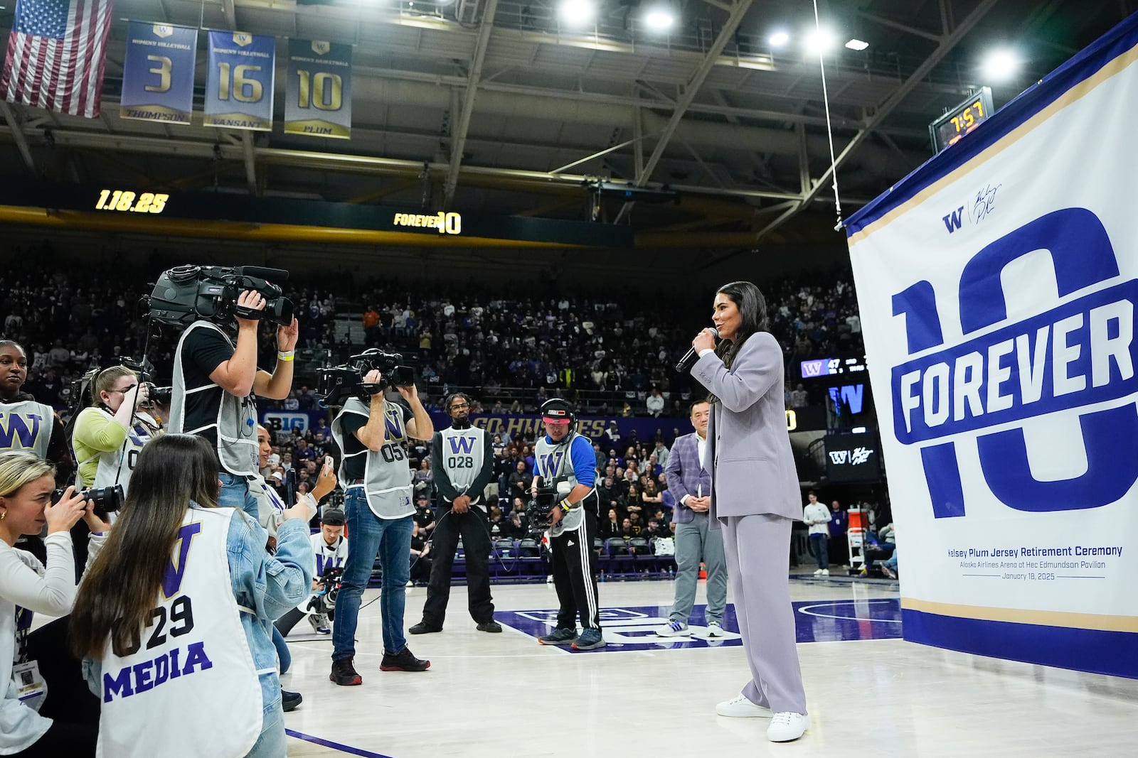 Former Washington guard and current Las Vegas Aces player Kelsey Plum speaks during her jersey retirement ceremony during halftime of an NCAA college basketball game between Washington and Purdue Saturday, Jan. 18, 2025, in Seattle. (AP Photo/Lindsey Wasson)