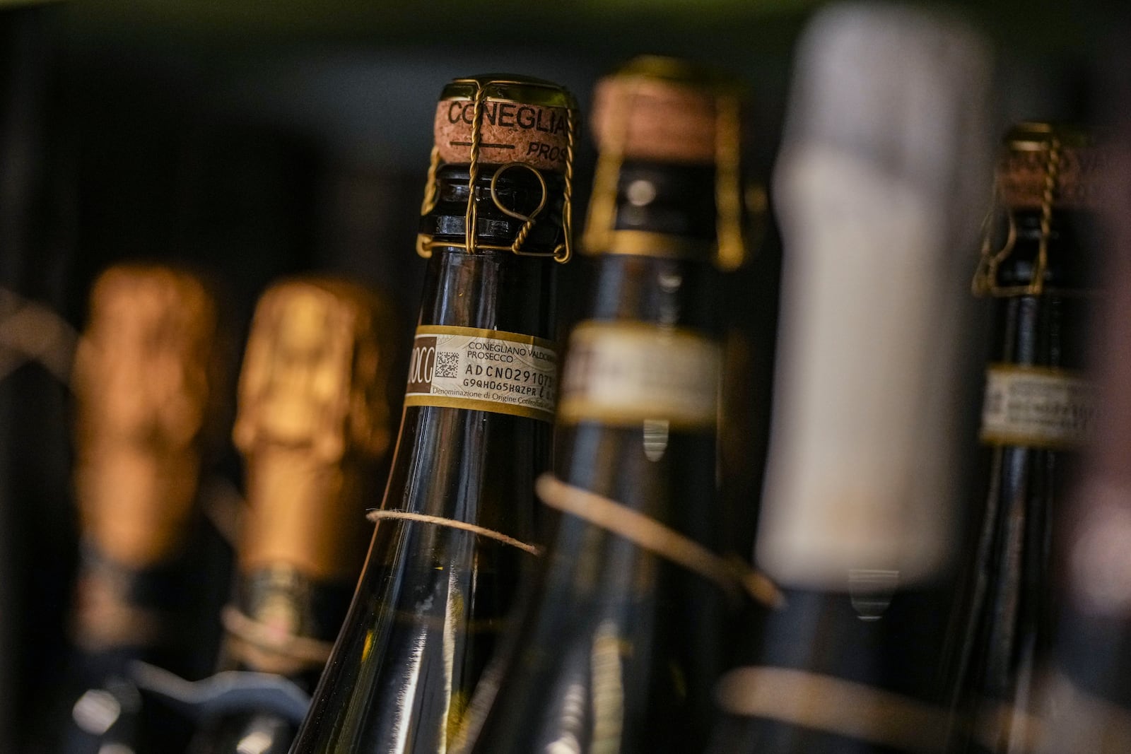 Bottles of Prosecco are lined up on a shelf of a wine shop in Rome, Thursday, Feb. 6, 2025. (AP Photo/Andrew Medichini)