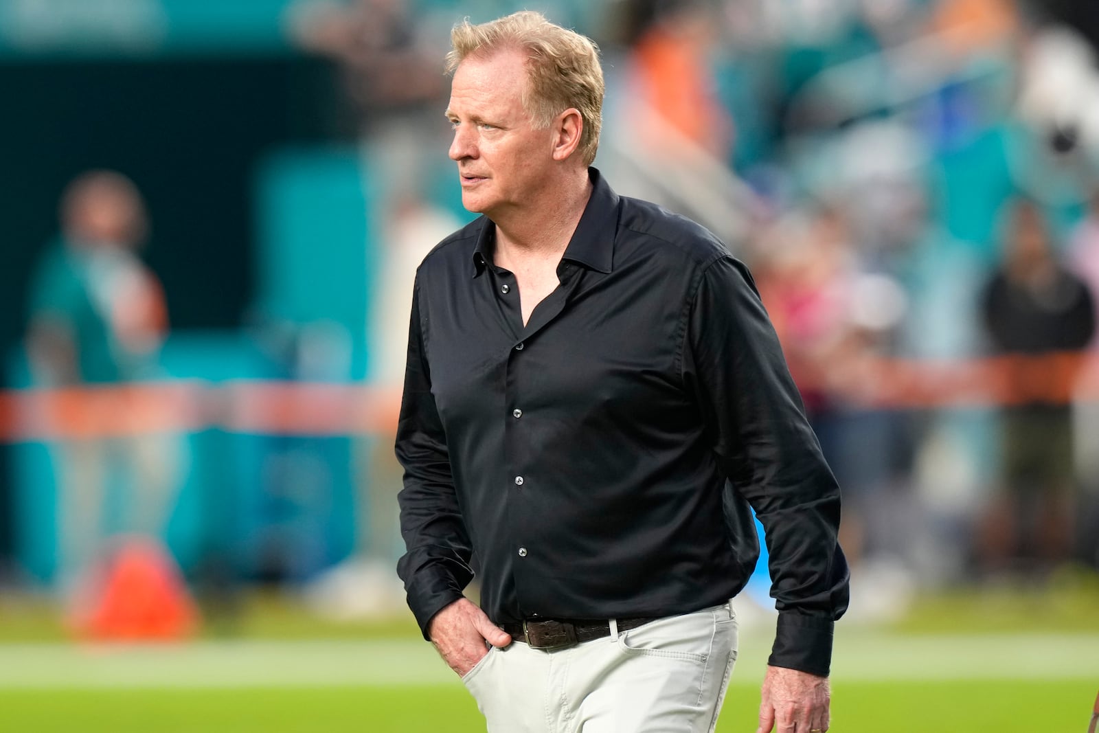 FILE - NFL Commissioner Roger Goodell walks on the field before an NFL football game between the Miami Dolphins and the Buffalo Bills, Sept. 12, 2024, in Miami Gardens, Fla. (AP Photo/Lynne Sladky, File)