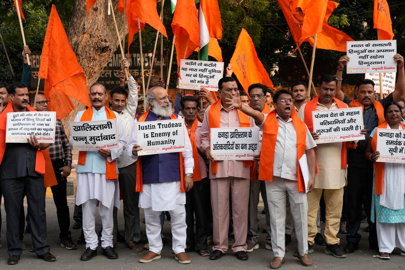 Activists of United Hindu Front, a right wing group reacting to Canada’s allegation that Indian Home Minister Amit Shah ordered the targeting of Sikh activists inside Canada, hold placards during a protest in New Delhi, India, Tuesday, Nov. 5, 2024. (AP Photo/Manish Swarup)