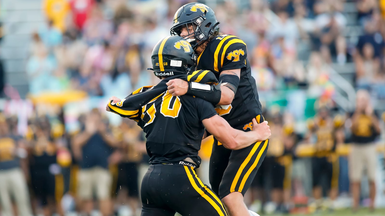 Shawnee High School's Brady Bumgardner (right) and Thomus Morgan celebrate after making a big defensive play during their game against Eaton last season. Michael Cooper/CONTRIBUTED