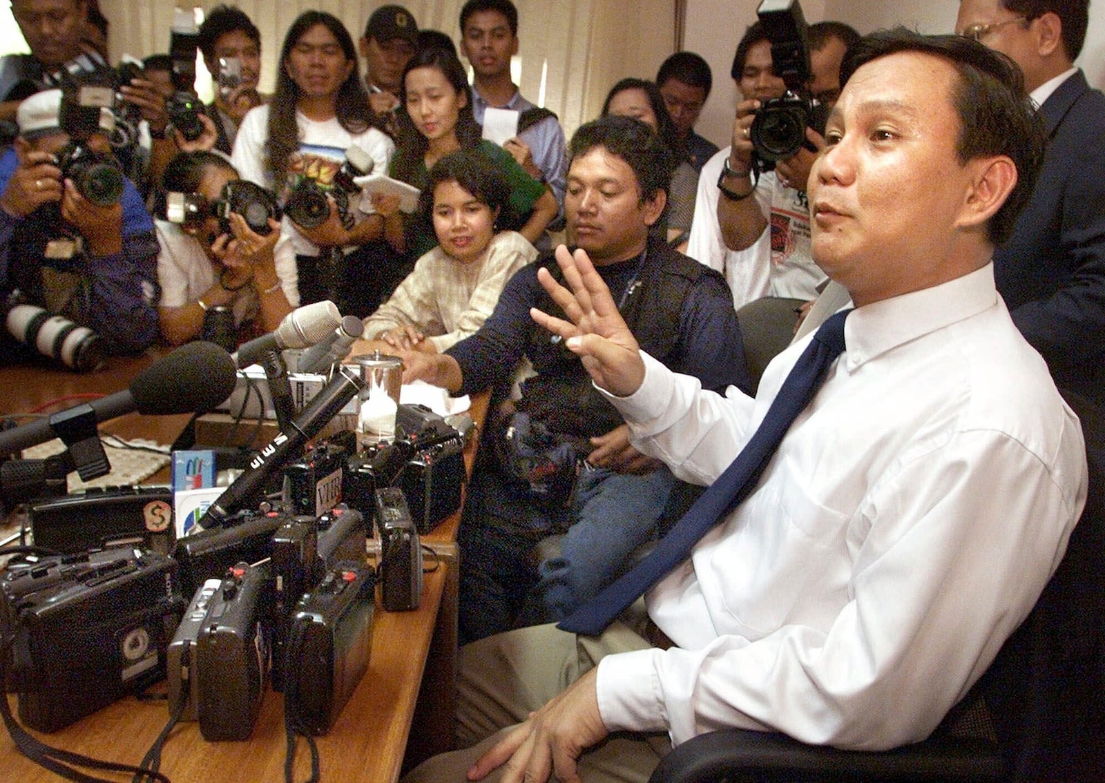 FILE- Retired Indonesian Lt. Gen. Prabowo Subianto, former leader of the elite Kopassus special forces, tells his side of the story during his first news conference since his return to Jakarta, May 9, 2000, where he denied masterminding the May 1998 riots and violence in Aceh, Irian Jaya, and East Timor. (AP Photo/Charles Dharapak, File)