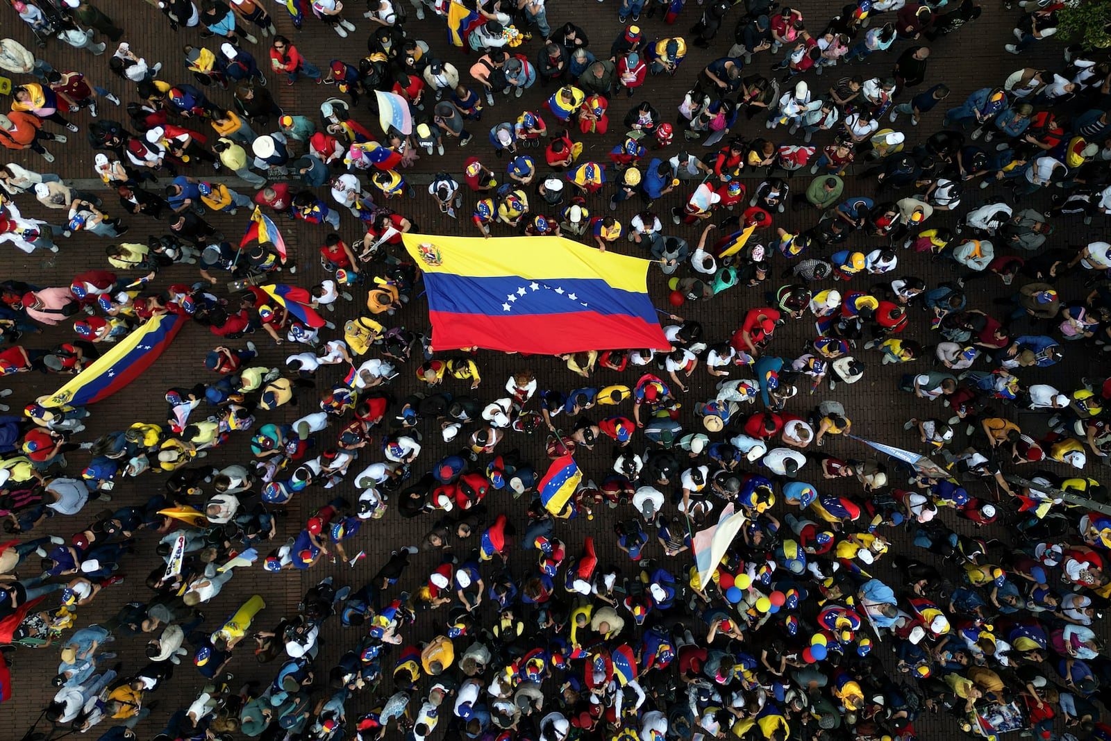 Opponents of Venezuelan President Nicolas Maduro protest the day before his inauguration for a third term in Bogota, Colombia, Thursday, Jan. 9, 2025. (AP Photo/Ivan Valencia)