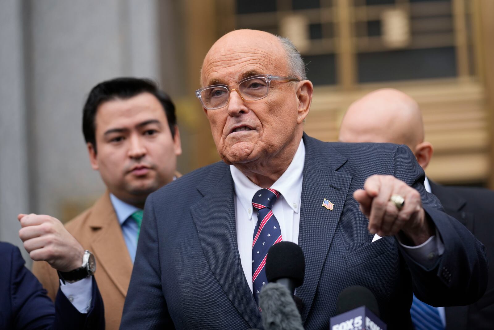 Rudy Giuliani speaks to reporters as he leaves the federal courthouse in New York, Tuesday, Nov. 26, 2024. (AP Photo/Seth Wenig)