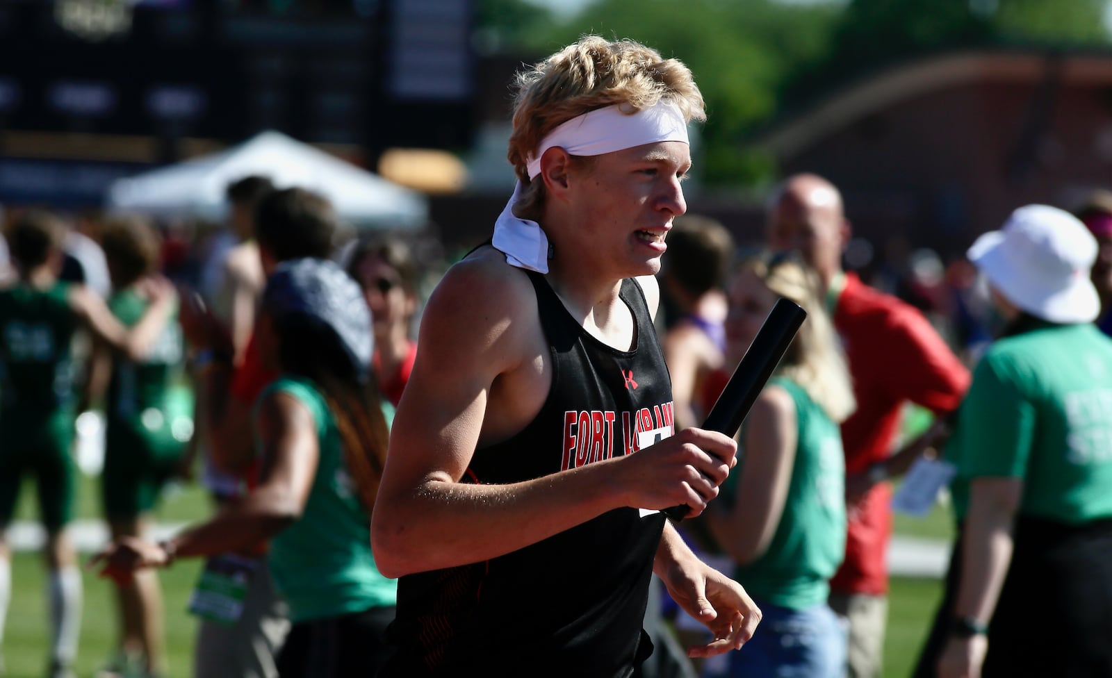 Fort Loramie's Colten Gasson runs the final leg and crosses the finish line for the winning the 4x800 relay in the Division III state track championship on Friday, June 3, 2022, at Jesse Owens Memorial Stadium in Columbus. David Jablonski/Staff