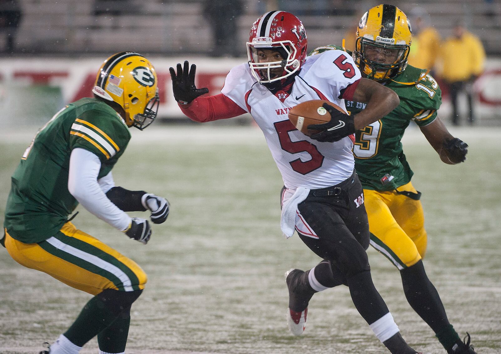 Dec. 4, 2010: Braxton Miller (5) prepares to stiff-arm St. Edwards defender Cory Blackstock during the fourth quarter of the Ohio High School Div. I Football Championship game in Canton. St. Edwards won the game 35-28. (PHIL LONG/OHIO PRESS PHOTO SYSTEM)