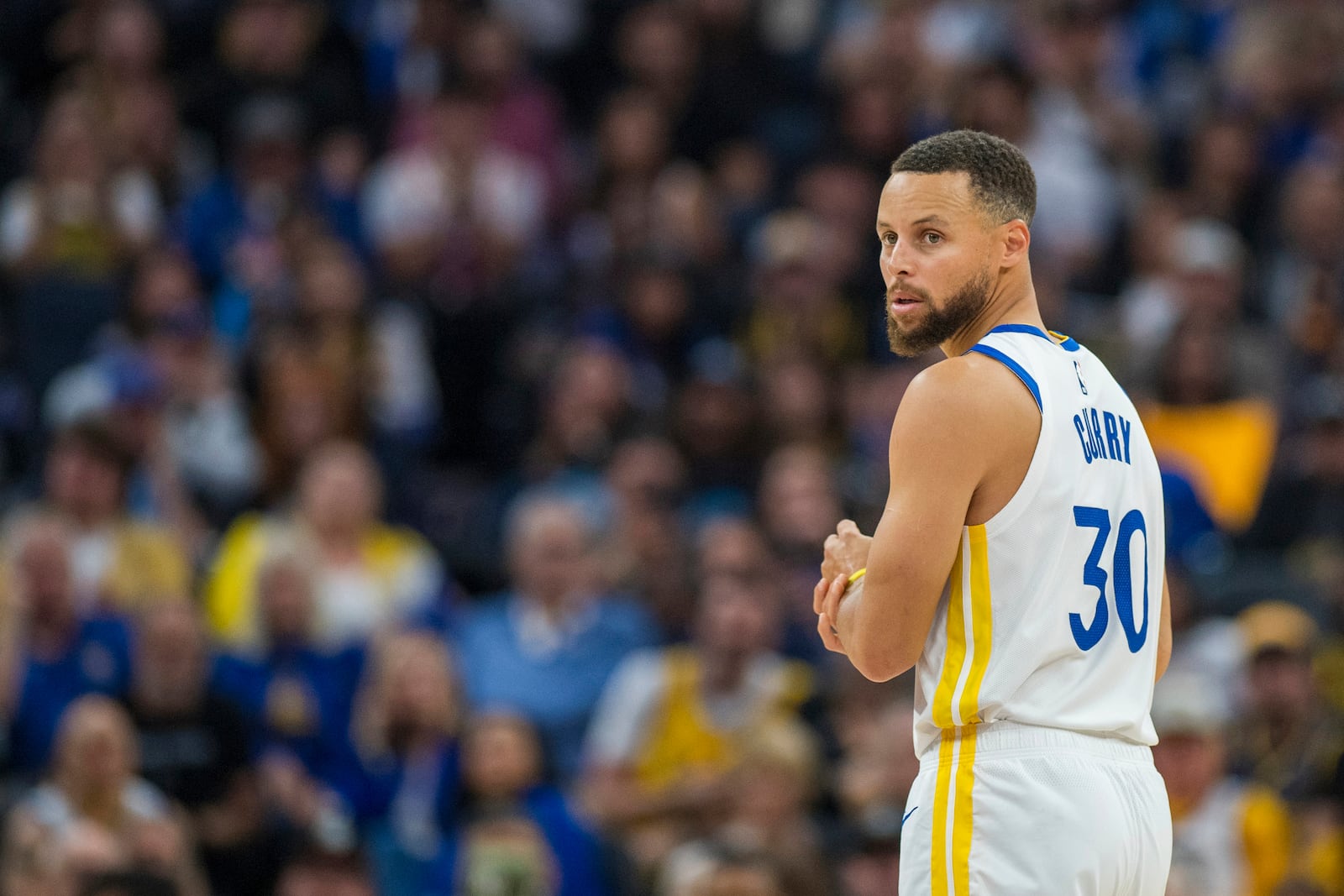 Golden State Warriors guard Stephen Curry (30) looks down the court during the first half of an NBA basketball game against the Los Angeles Clippers in San Francisco, Sunday, Oct. 27, 2024. (AP Photo/Nic Coury)