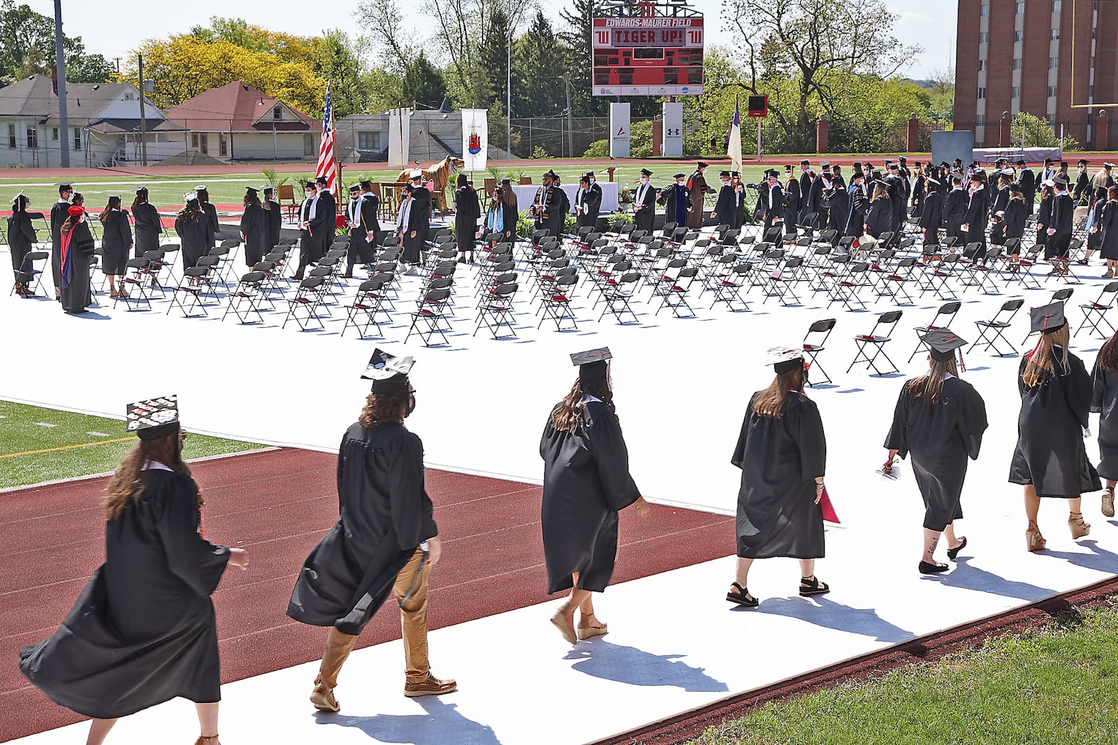 Wittenberg University held their 171 Commencement Ceremony Saturday at the school's Edwards-Maurer Stadium instead of the traditional Commencement Hollow.  To provide space for social distancing, the commencement was divided into two ceremonies and masks were worn by the graduates and their families. BILL LACKEY/STAFF