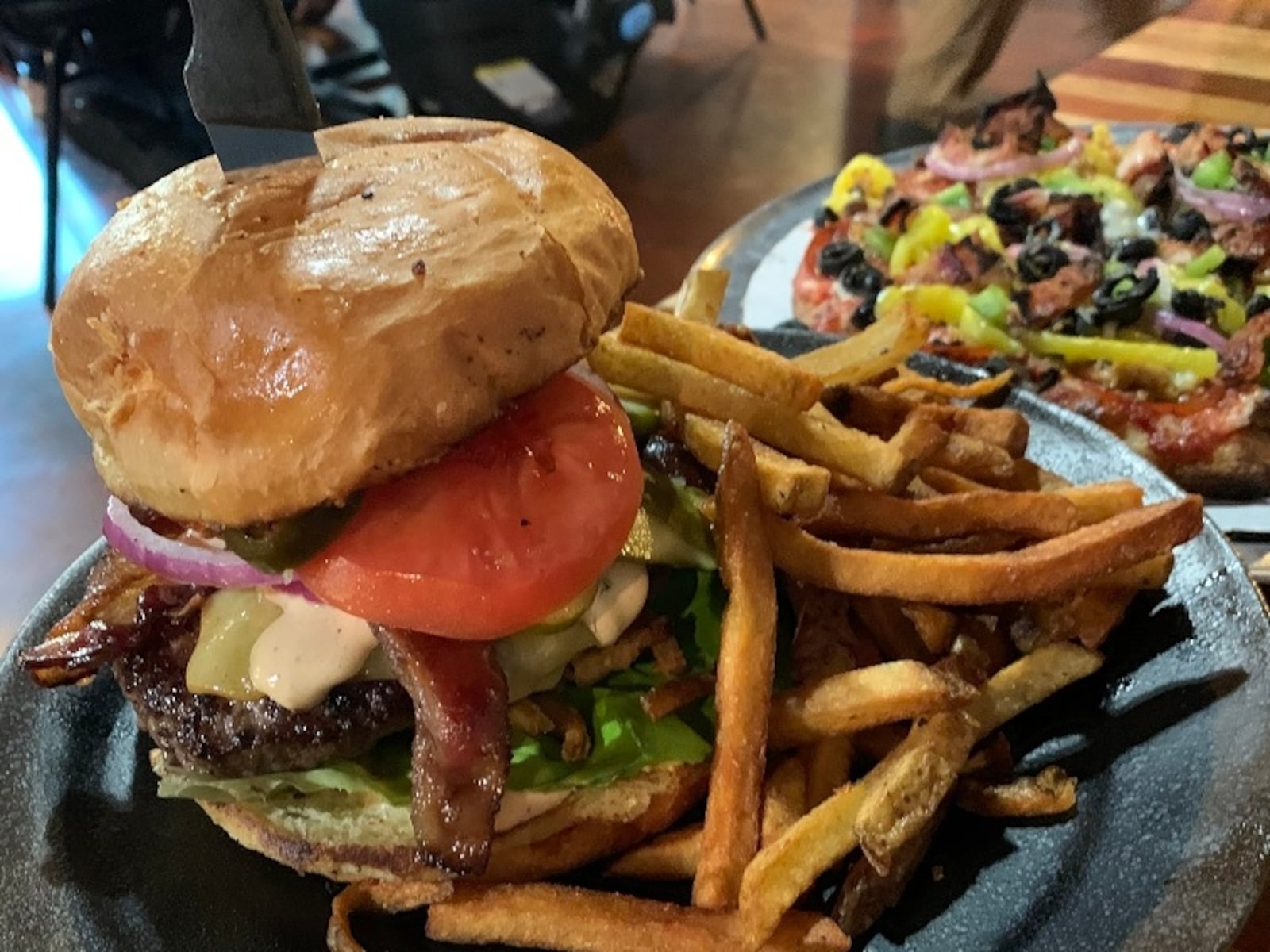 The 571 Grill and Draft House in New Carlisle serves burgers, wings, pizza and fries that are loaded with flavor. CONTRIBUTED/ALEXIS LARSEN