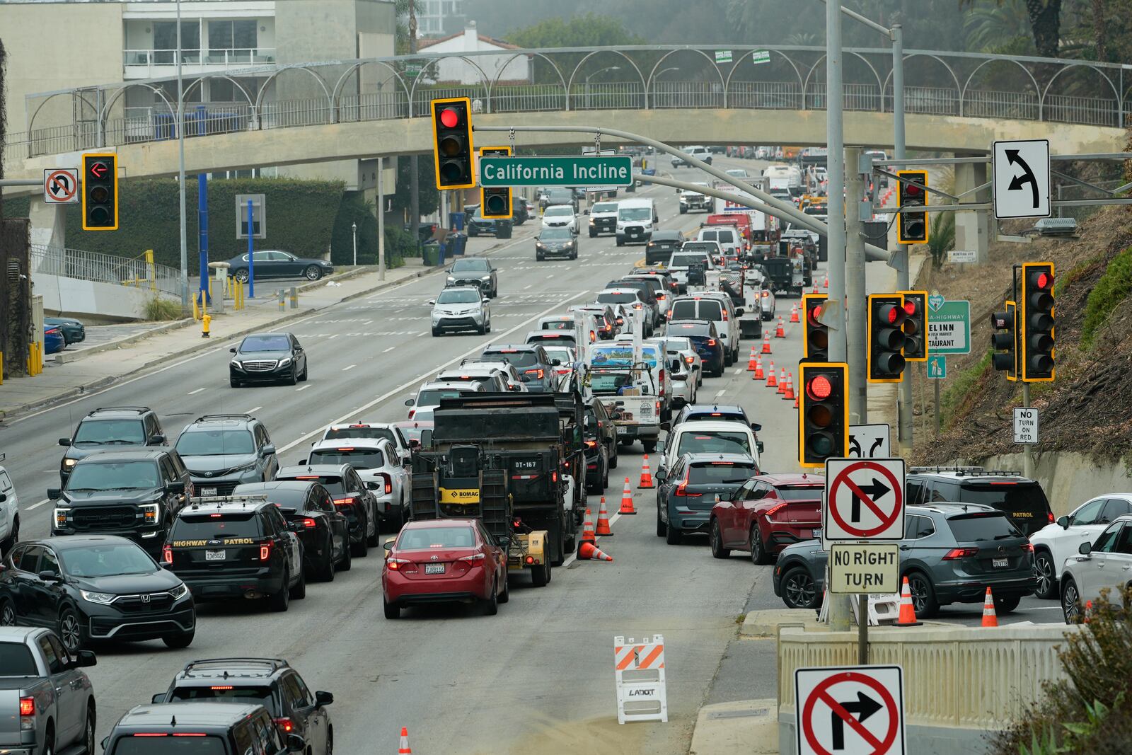 Motorists line up along Pacific Coast Highway near the Palisades Fire zone Monday, Feb. 3, 2025, in Santa Monica, Calif. (AP Photo/Damian Dovarganes)