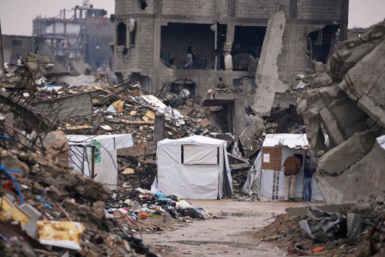 Tents are seen next to the rubble of destroyed homes and buildings in Beit Lahiya, northern Gaza Strip, Thursday March 6, 2025.(AP Photo/Abdel Kareem Hana)