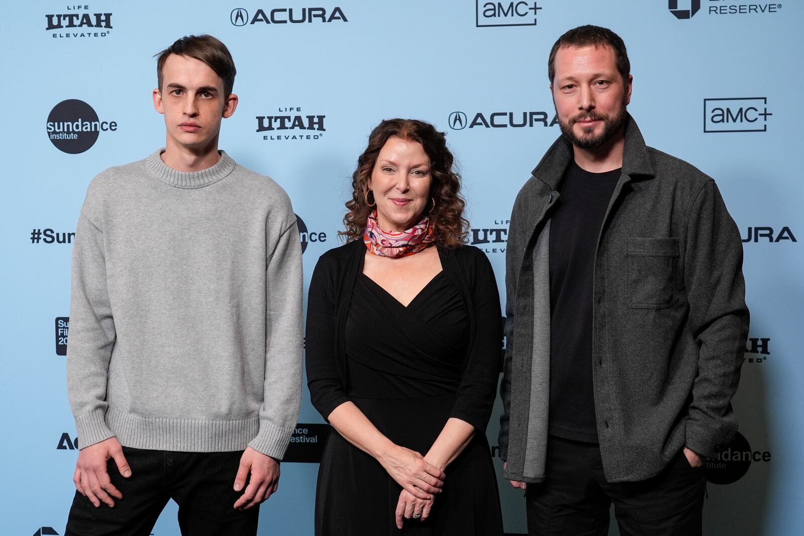 Alex Babenko, from left, Raney Aronson-Rath, and Mstyslav Chernov attend the premiere of "2000 Meters to Andriivka" during the Sundance Film Festival on Thursday, Jan. 23, 2025, at The Ray Theatre in Park City, Utah. (AP Photo/Chris Pizzello)