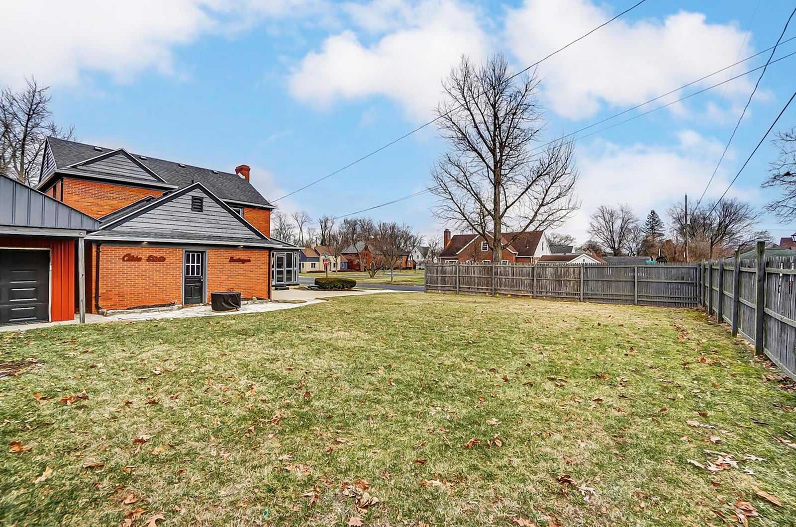 The back yard has a wood privacy fence surrounding it.