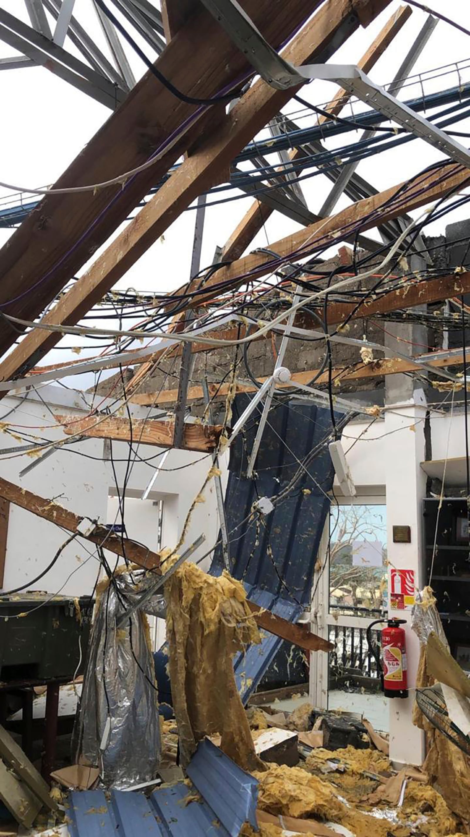 This photo provided Sunday Dec.15, 2024 by the French Army shows a damaged house in the French territory of Mayotte in the Indian Ocean, after Cyclone Chido caused extensive damage with reports of several fatalities. (Etat Major des Armées via AP)