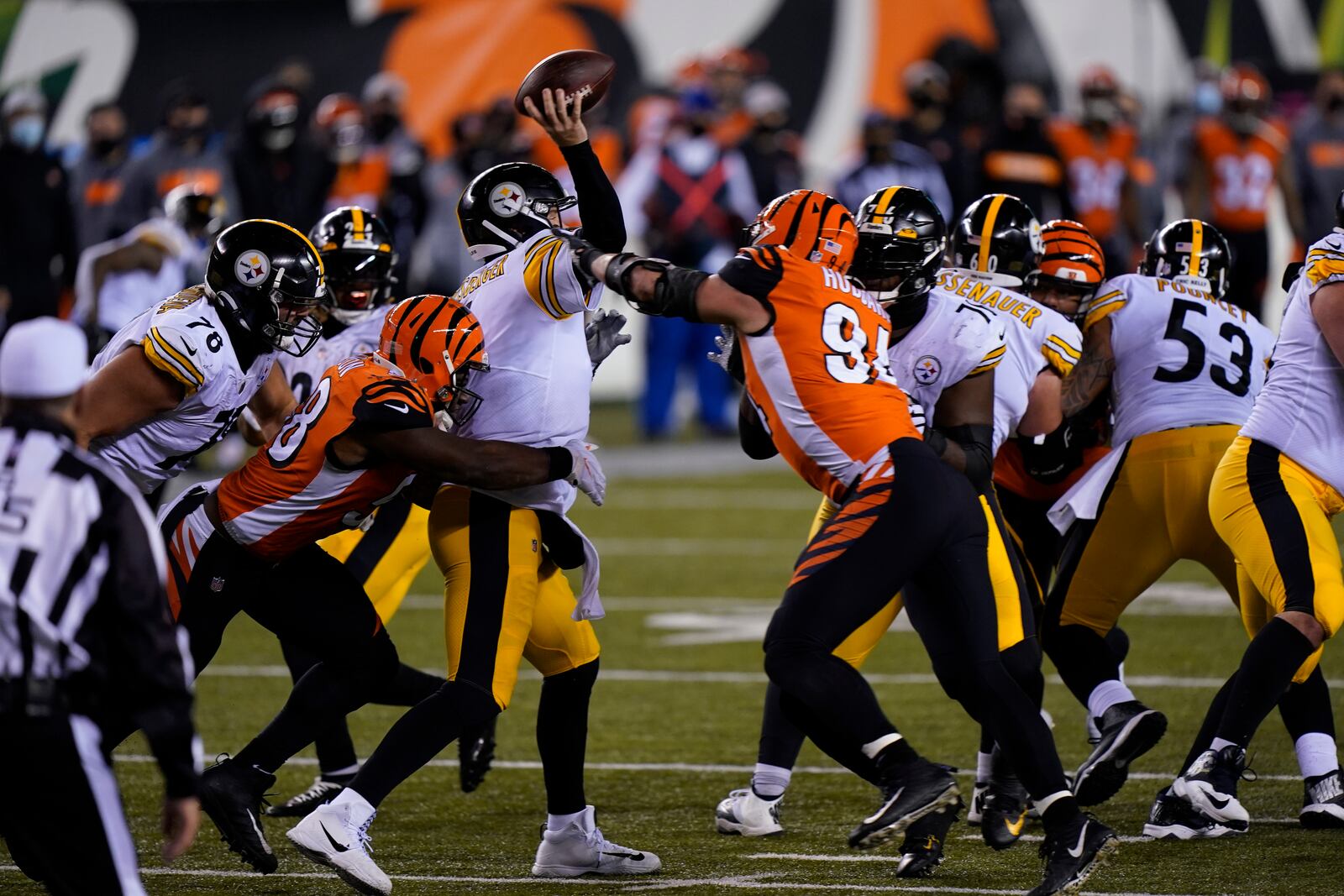 Pittsburgh Steelers quarterback Ben Roethlisberger (7) is hit as he throws during the second half of an NFL football game against the Cincinnati Bengals, Monday, Dec. 21, 2020, in Cincinnati. (AP Photo/Bryan Woolston)