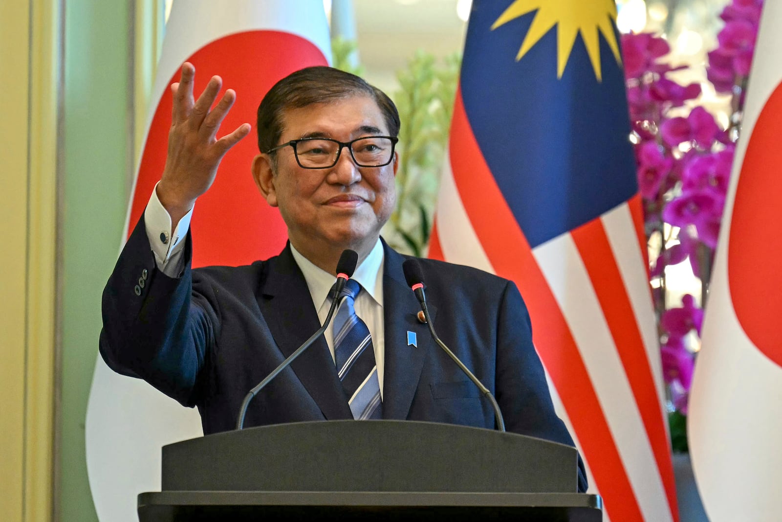 Japan's Prime Minister Shigeru Ishiba gestures during a joint press conference with Malaysia's Prime Minister Anwar Ibrahim at the prime minister's office in Putrajaya, Malaysia, Friday, Jan. 10, 2025. (Mohd Rasfan/Pool Photo via AP)