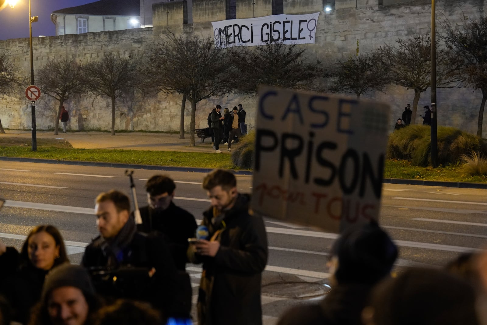 Media wait outside the courthouse of Avignon during the trial of Dominique Pelicot, in Avignon, southern France, Thursday, Dec. 19, 2024. (AP Photo/Lewis Joly)