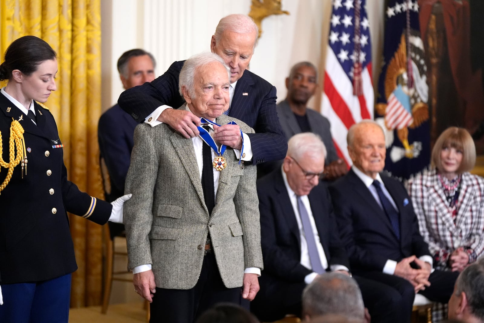 President Joe Biden, right, presents the Presidential Medal of Freedom, the Nation's highest civilian honor, to fashion designer Ralph Lauren in the East Room of the White House, Saturday, Jan. 4, 2025, in Washington. (AP Photo/Manuel Balce Ceneta)