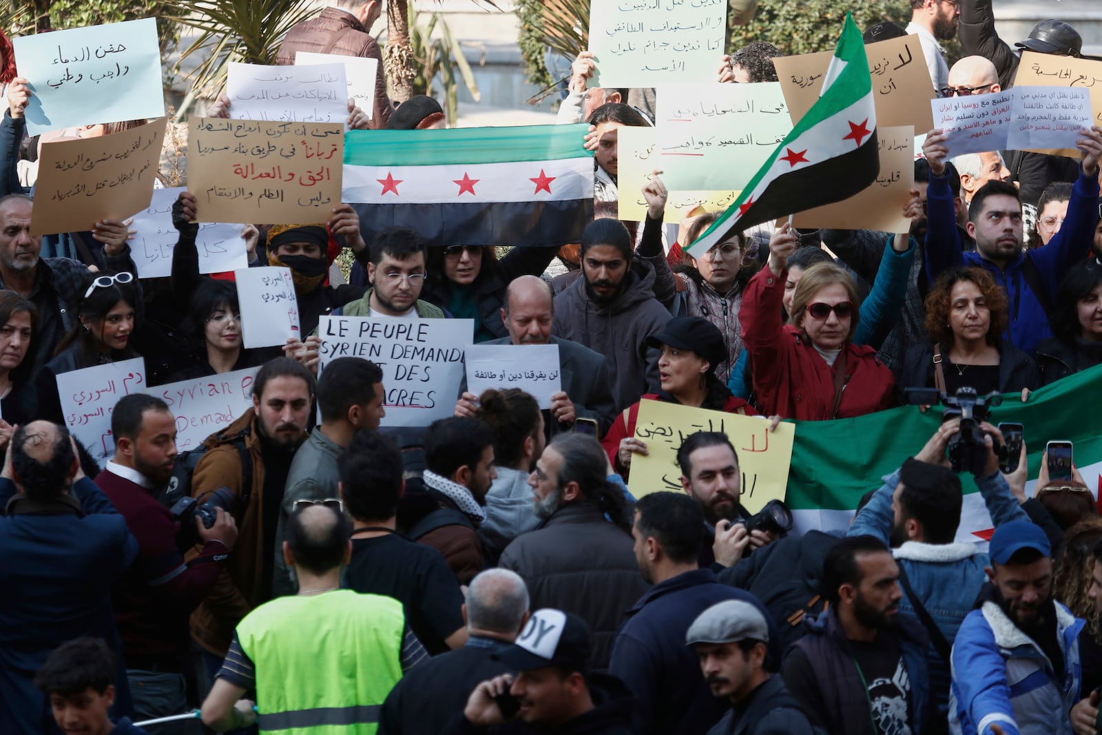 Activists demonstrate against violence in the coastal region of Damascus, Syria, Sunday, March 9, 2025. (AP Photo/Omar Sanadiki)