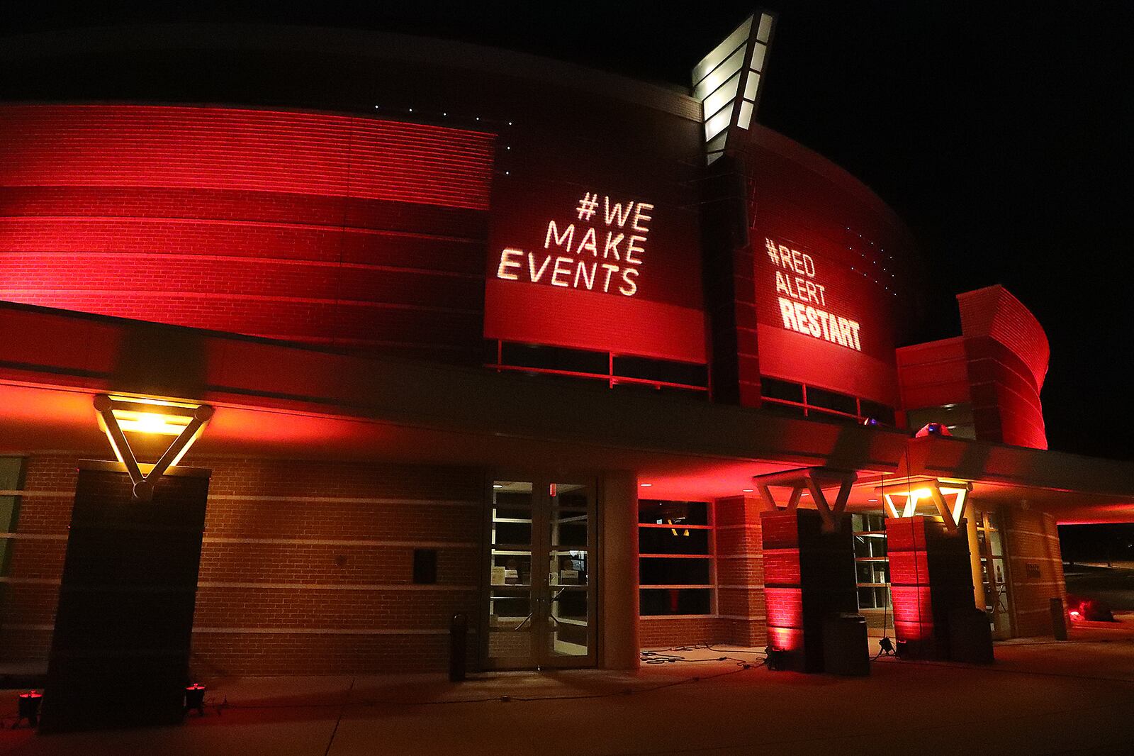 The Clark State Performing Arts Center is illuminated in red light on Sept. 1, 2021 for the RED ALERT RESTART campaign. The campaign's focus was to raise public awareness about the entertainment industry's financial plight due to the COVID-19 pandemic. More than 5,000 buildings across the country lit up red. The PAC has received nearly $225,000 federal relief funds through the Shuttered Venue Operators Grant program.  BILL LACKEY/STAFF